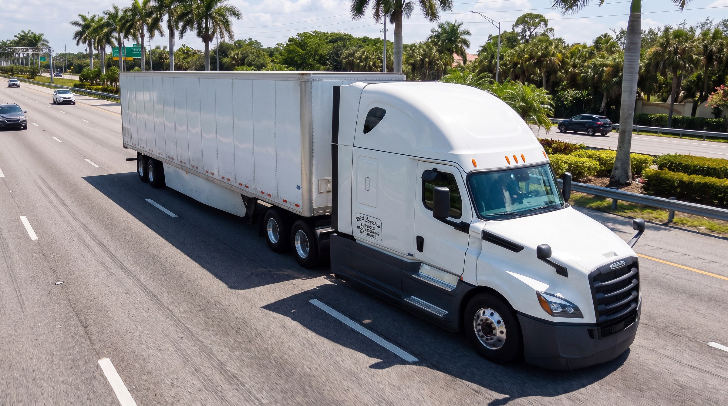 RC4 Logistics Freightliner Cascadia on the highway